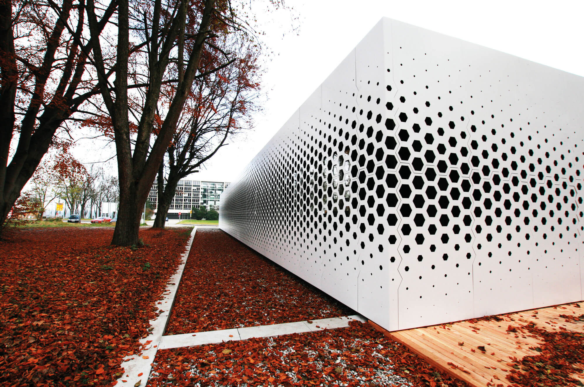 big white metal box along with old trees